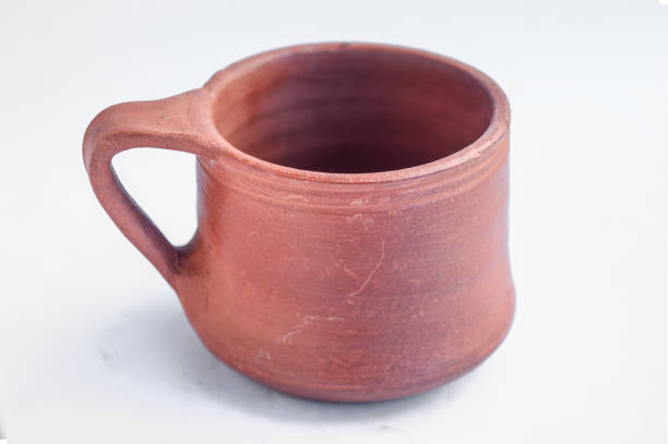 istock Clay made coffee cup or mug isolated on white background 1355280422