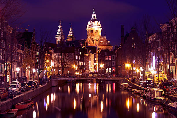 istock Amsterdam with the St. Niklaas church in Netherlands 135528854