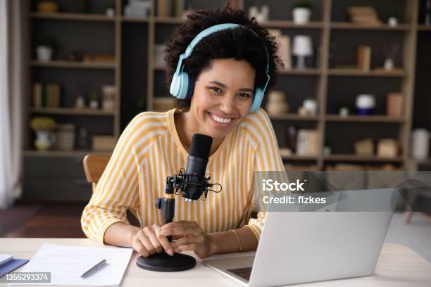 Happy Young Black Woman In Headphones And Professional Microphone Recording Stock Photo - Download Image Now