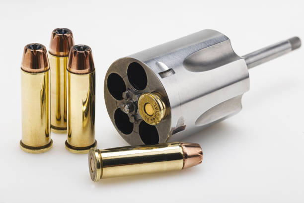 istock .38 special gun bullets with stainless revolver cylinder on white background 1355293448