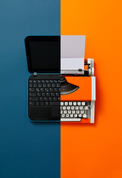 istock Digital und analog – Laptop and 80s Typewriter 1355294181