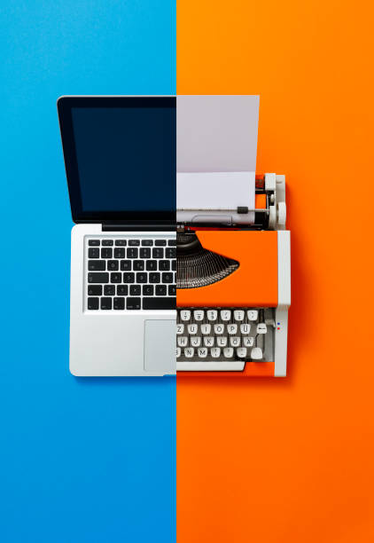 istock Digital und analog – Laptop and 70s Typewriter 1355294193