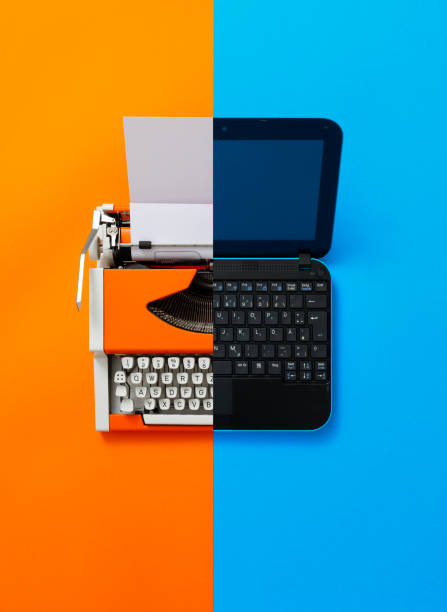 istock Digital und analog – Laptop and 80s Typewriter 1355294206