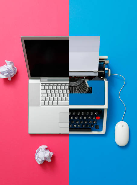 istock Digital und analog – Laptop and 80s Typewriter 1355294738