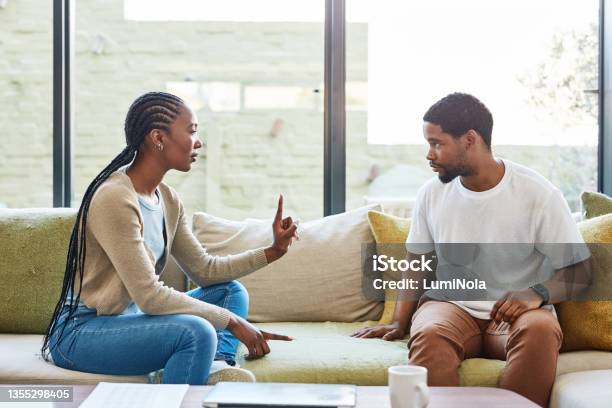 Shot Of A Young Couple Having A Disagreement At Home Stock Photo - Download Image Now