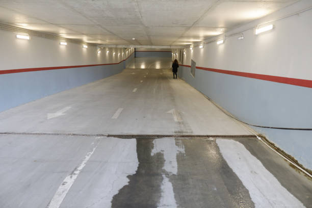istock Shallow depth of field (selective focus) image with the entrance - exit of an underground parking. 1355298751