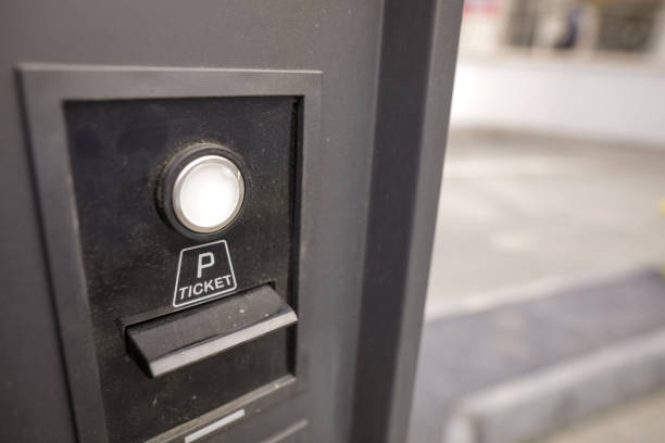 istock Shallow depth of field (selective focus) image with a dirty  ticket machine before entering an underground parking. 1355298755