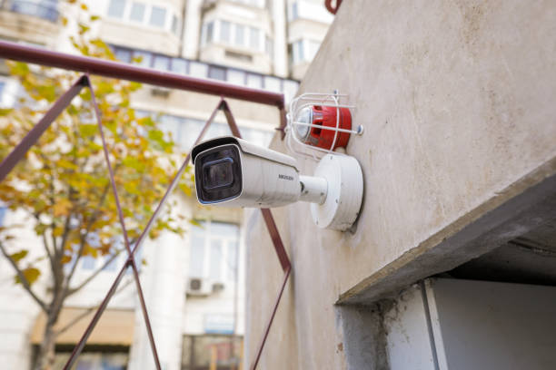 istock Details with a CCTV camera on a wall outside a building. 1355298756