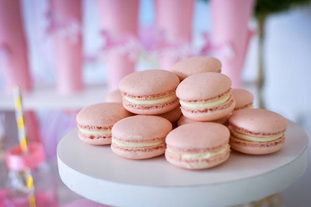 istock Beautiful pink sandwich cookies on a plate 1355298873