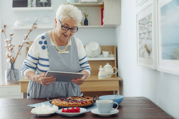 istock Senior woman at home 1355299826