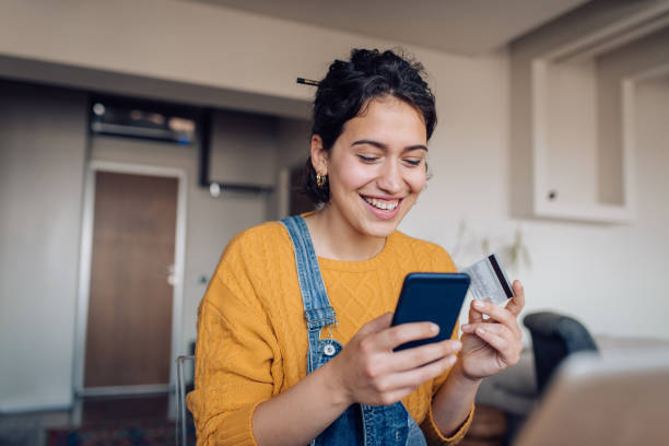 istock Young woman shopping online 1355299861