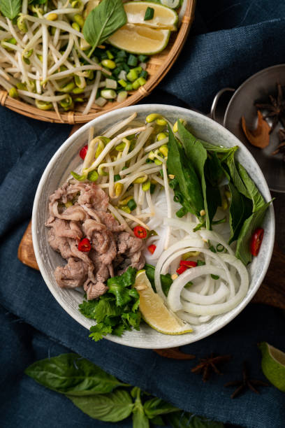 istock Delicious vietnamese beef noodles pho with ingredients. 1355302941