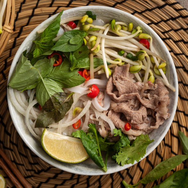 istock Delicious vietnamese beef noodles pho with ingredients. 1355302945
