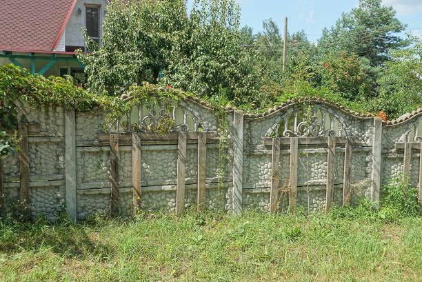 istock part of an old gray broken fence wall 1355304135