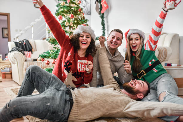 istock Happy Couples Celebrating Christmas Together 1355308489