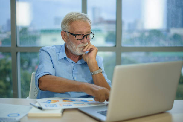 istock Caucasian senior Businessman working in modern office 1355308938