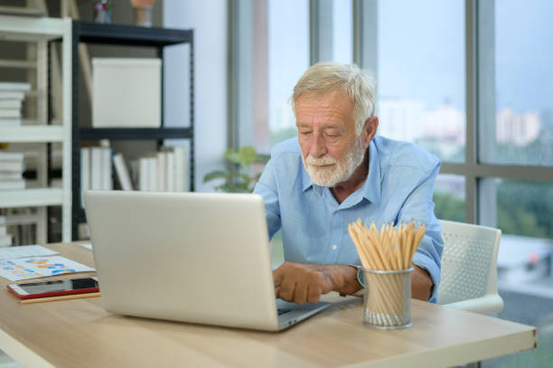 istock Caucasian senior Businessman working in modern office 1355309761