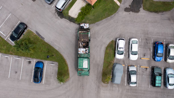 istock A top down view directly above a garbage truck picking up a garbage container in Fort Lauderdale, Florida on a sunny morning. 1355309925