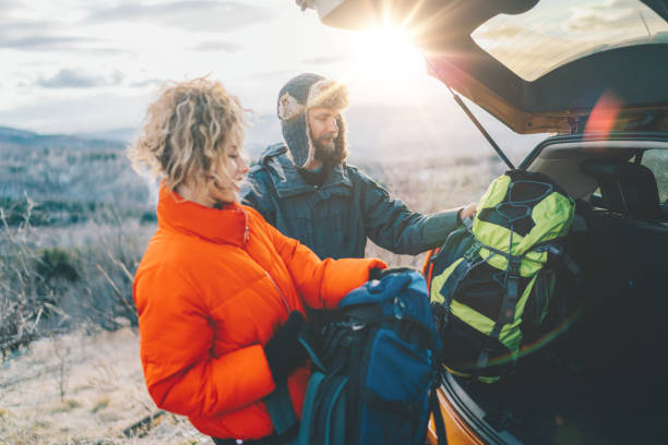 istock Couple on winter hiking trip 1355313761