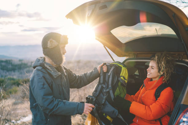 istock Couple on winter hiking trip 1355313878