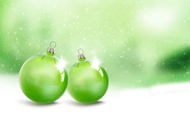 Green Christmas balls against a green background