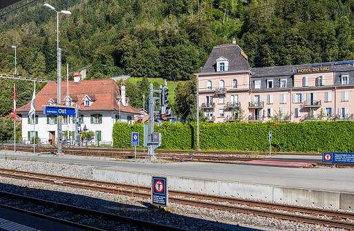 Interlaken, Switzerland - August 23, 2016: In the railway station of Interlaken East. From here the famous train that leads tourists to Jungfraujoch (3,466 m - 11,371 ft) starts. In the background, the world famous \