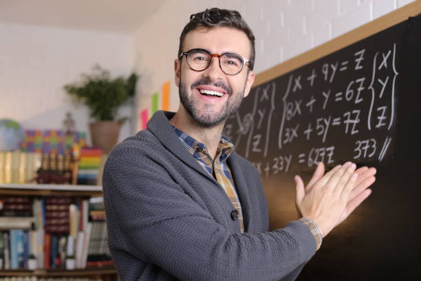 istock University teacher clapping hands in classroom 1355318008