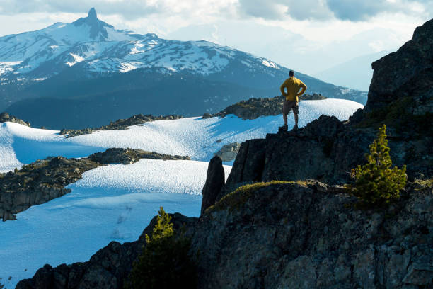 istock Man solo hiking in the mountains 1355318063