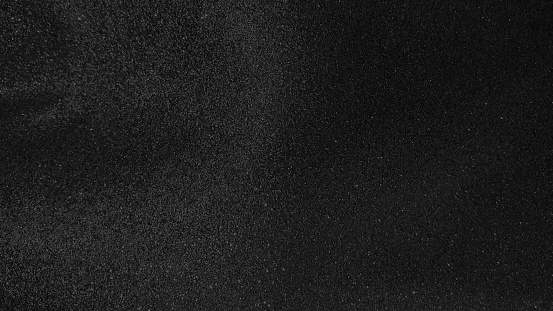 dark black glitter background. abstract sparkle texture. elegant and luxury mood background. black glitter texture. abstract background for celebration concept.