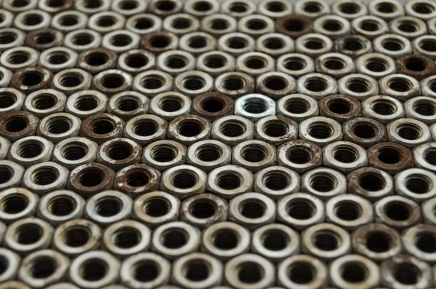 istock Background of metal mounting nuts. 1355320273