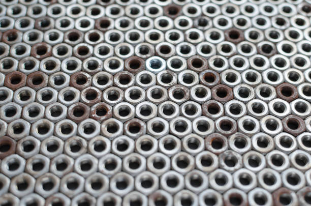 istock Background of metal mounting nuts. 1355320277