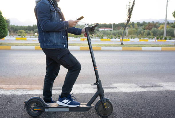 istock Activating electric scooter from smart phone 1355321904