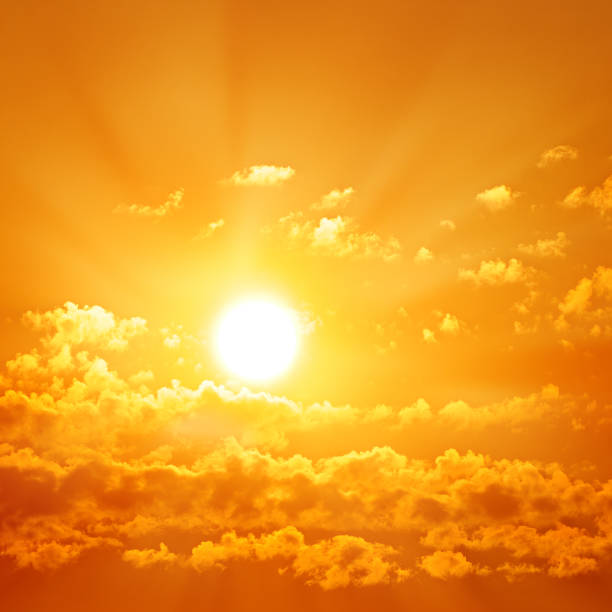 istock Bright orange sunrise and small cumulus clouds. 1355323219