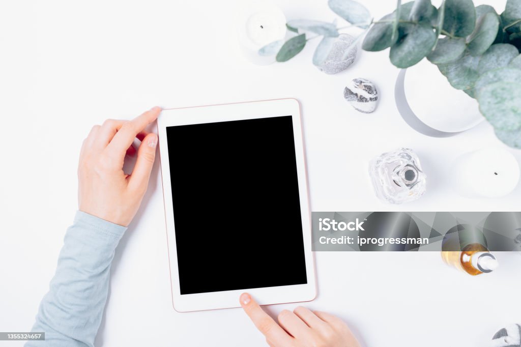 Female Hands Using Tablet Computer Next To Feminine Accessories Stock ...
