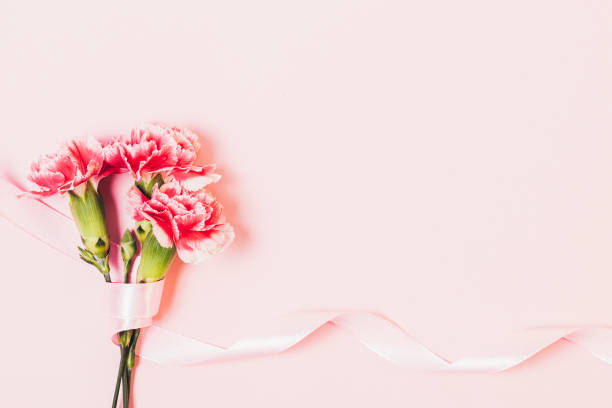 istock Festive pink background with bouquet flowers 1355324678