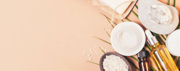istock Natural beauty products background with essential oil bottles 1355324751