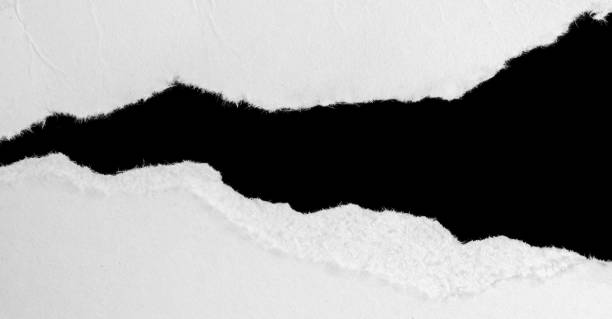istock a white piece of paper on a black isolated background 1355327094