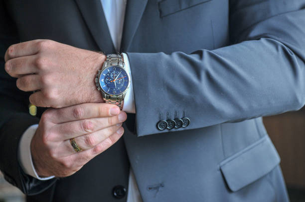 istock Groom detail watch on hand 1355327308