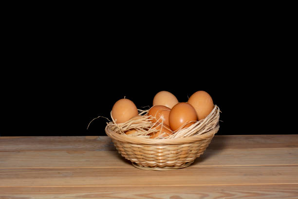 istock eggs in basket on wooden table 1355328543