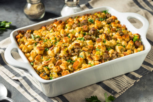 Homemade Thanksgiving Pork Sage Stuffing Homemade Thanksgiving Pork Sage Stuffing in a Casserole Dish stuffing food photos stock pictures, royalty-free photos & images