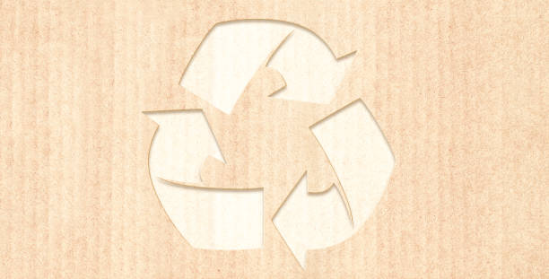 istock Arrows recycle symbol on striped cardboard texture 1355329278