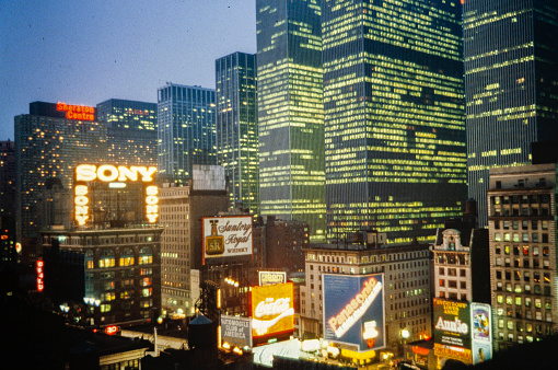 NEW YORK, UNITED STATES MAY 1970: New York night street view billboards in 70's