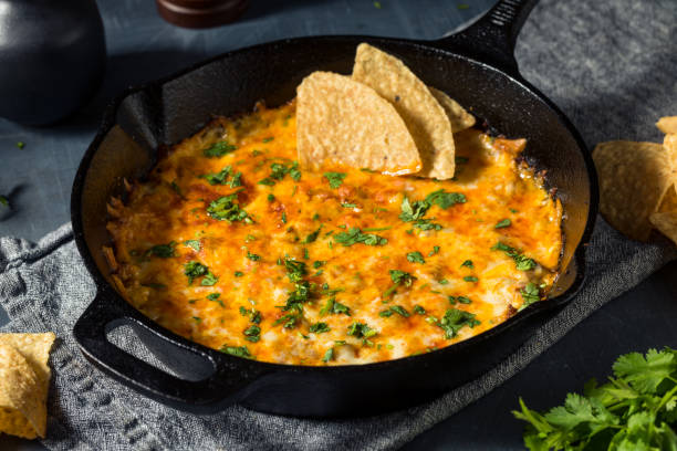 Homemade Mexican Chorizo Queso Oaxaca Dip Homemade Mexican Chorizo Queso Oaxaca Dip with Tortilla Chips cheese dip stock pictures, royalty-free photos & images
