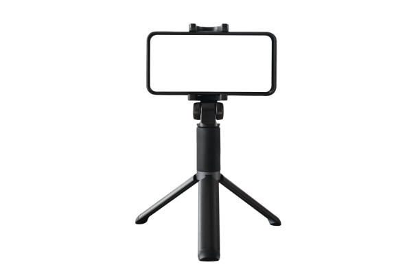 smartphone and mini tripod isolated on white - tripod camera photographic equipment photography imagens e fotografias de stock