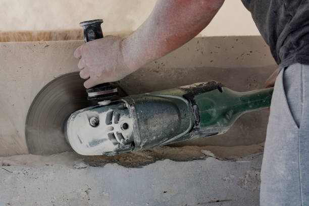 istock Sculptor shapes marble with his tool 1355330772