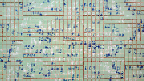 Small blue and green tiles mosaic background, gresite, full frame view.