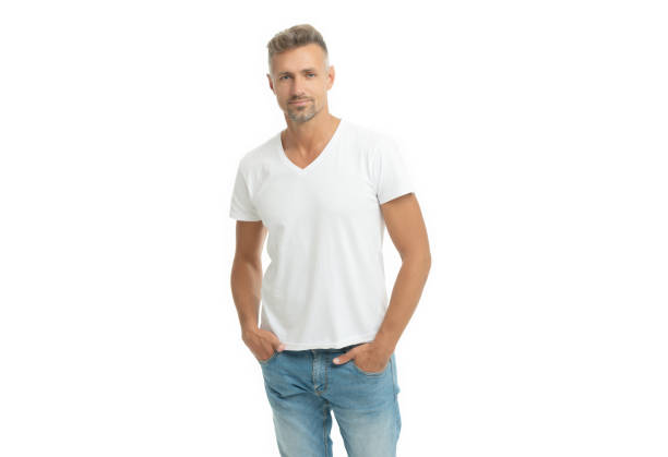 istock Serious handsome guy in white tshirt keep hands in jeans pockets isolated on white, casual 1355332317