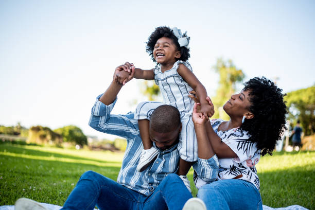 istock Family spending an afternoon in the park 1355338308