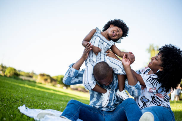 istock Family spending an afternoon in the park 1355338310