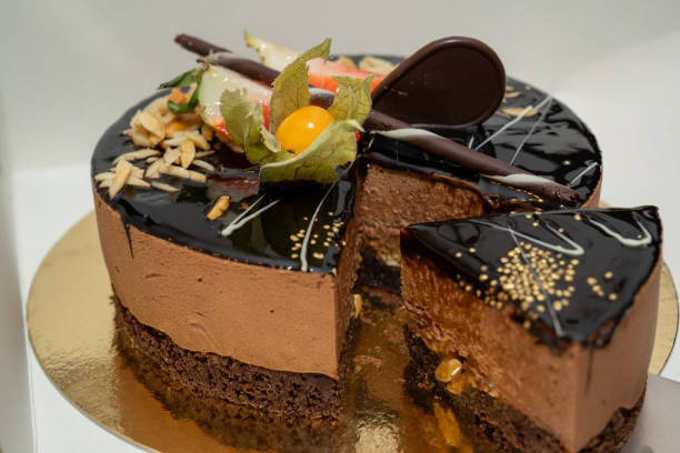 istock Cut chocolate cake with fresh fruits 1355338849